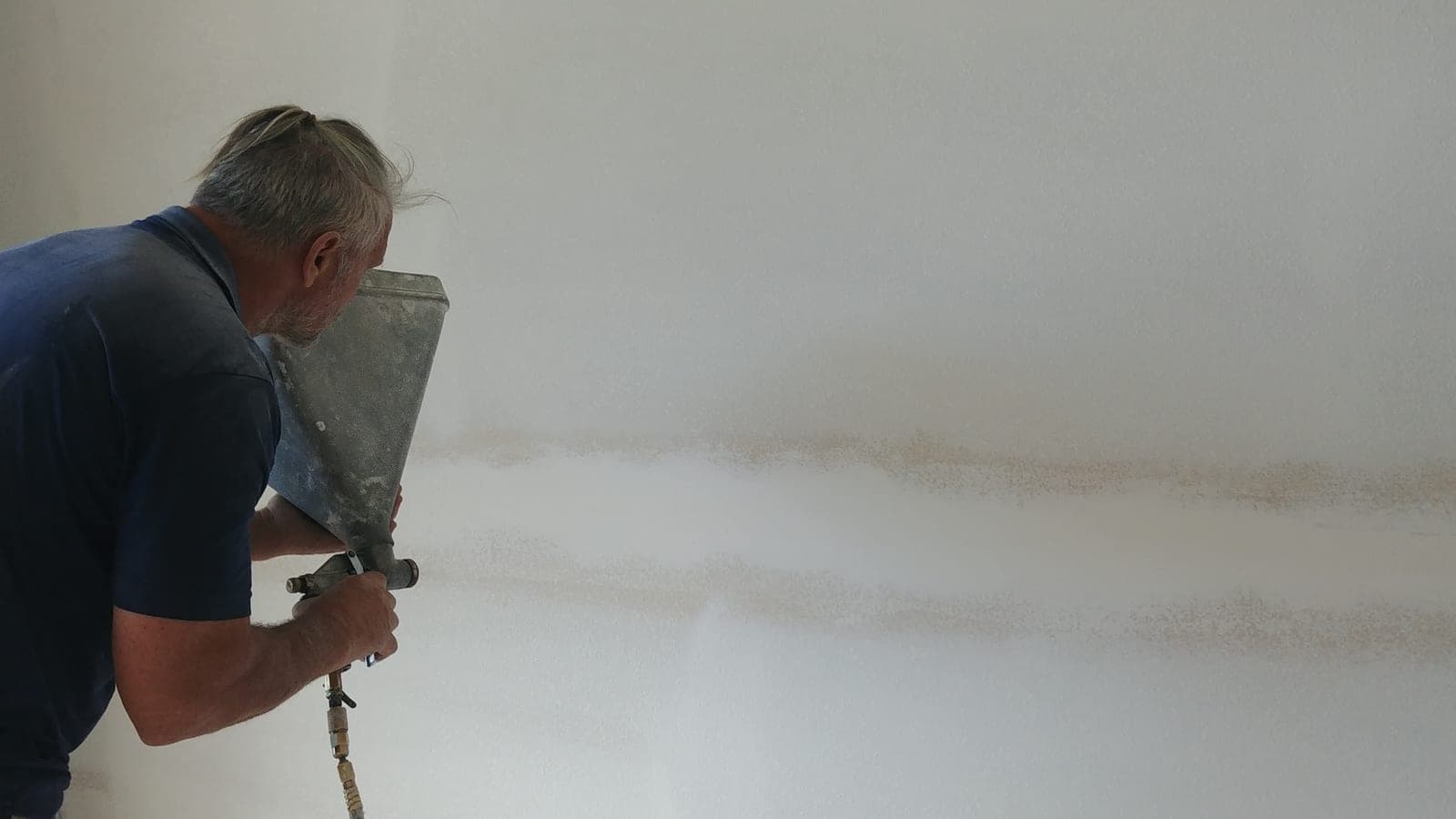 Drywall texture spray in progress